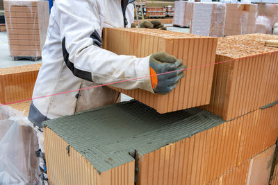 Bricklayer at work at new house in construction