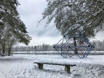 Frozen lake against sky during winter