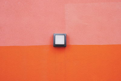 Close-up of electric light on wall