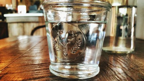 Close-up of glass jar on table