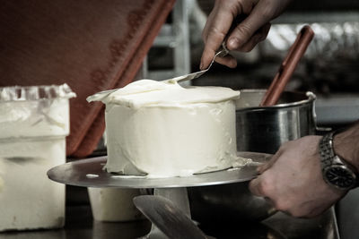 Close-up of man preparing food