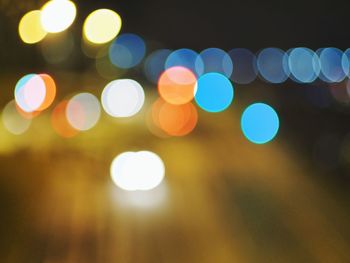 Defocused image of illuminated lights at night