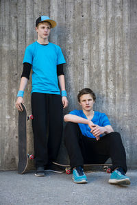 Two teenage boys against concrete wall, stockholm, sweden