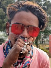 Close-up portrait of man wearing sunglasses