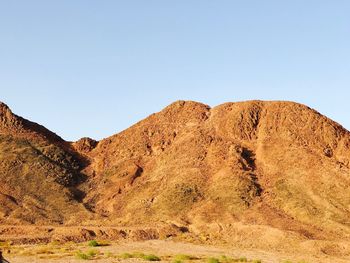 Scenic view of rocky mountains against clear sky