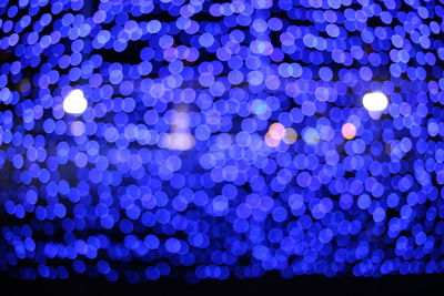 Defocused image of illuminated lights at night