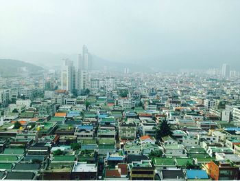 High angle view of buildings against sky in city