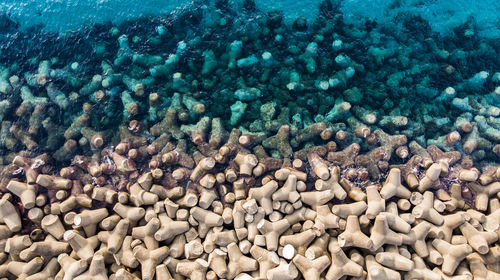 Top down view of wavebreakers protecting the harbour of buggerru.