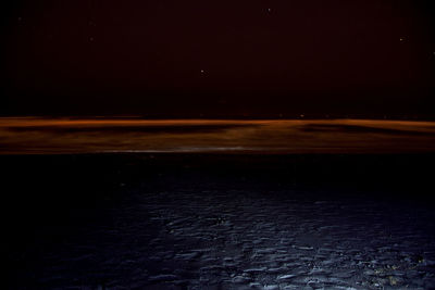 Scenic view of sea against sky at night