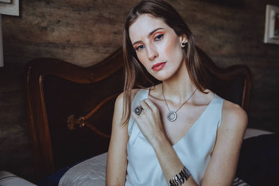 Portrait of woman sitting at home