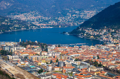 The city of como, the lake, the lakeside promenade, the buildings, photographed from above.