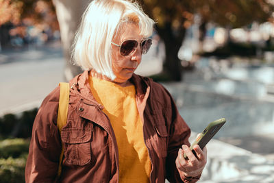 Young woman using mobile phone