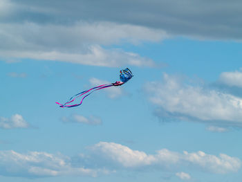 Low angle view of kite flying in sky