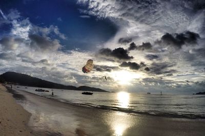 Scenic view of beach against sky during sunset