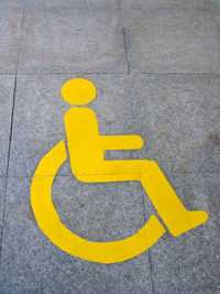 High angle view of disabled sign on road