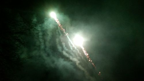 Low angle view of illuminated sky at night