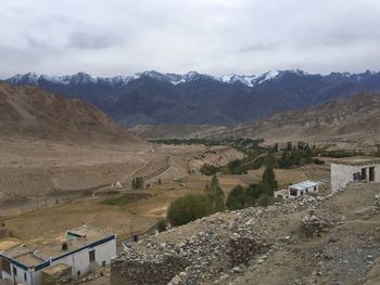 High angle view of road amidst buildings against sky