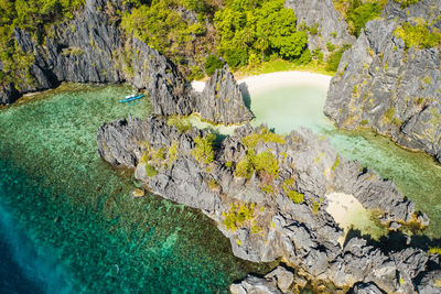 High angle view of water flowing through rocks