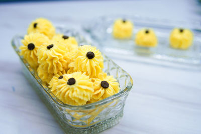 Close-up of yellow flower on table