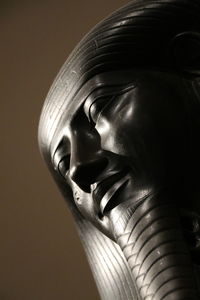 Close-up of statue against black background