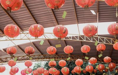 Low angle view of lanterns hanging on roof