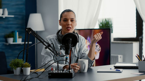 Businesswoman using laptop at office