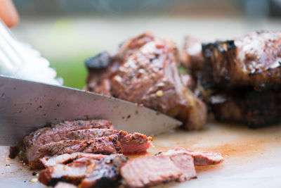 Close-up of meat on barbecue grill