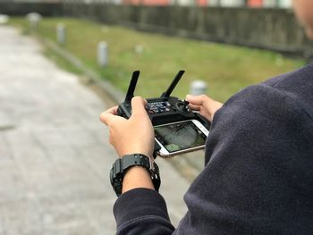 Close-up of man photographing