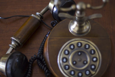 Close-up of telephone on table