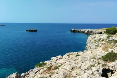 Scenic view of sea against clear blue sky