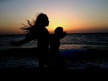 Scenic view of sea at sunset