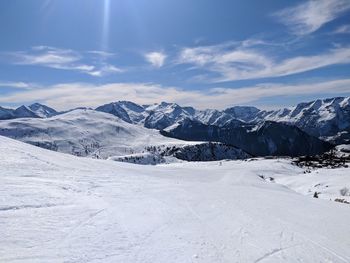 Scenic view of snowcapped mountains against sky