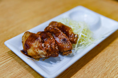 High angle view of meat in plate on table