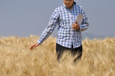 Rear view of man standing on field