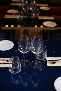 Close-up of wine glasses on table