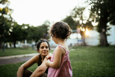 Mother and daughter on field