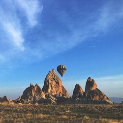 Rock formations on land against sky