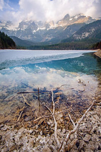 Scenic view of lake and mountains against sky