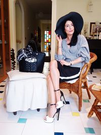 Young woman sitting on chair