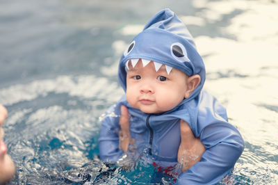 Portrait of cute baby girl in water