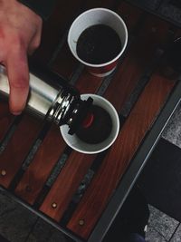 Close-up of hand holding piano