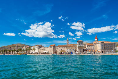 Scenic view of the old city of trogir in croatia against dramatic summer sky