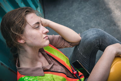 Portrait of a young woman looking away