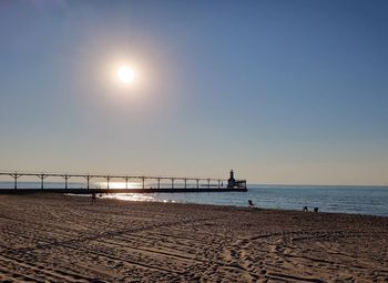 Scenic view of sea against clear sky during sunset