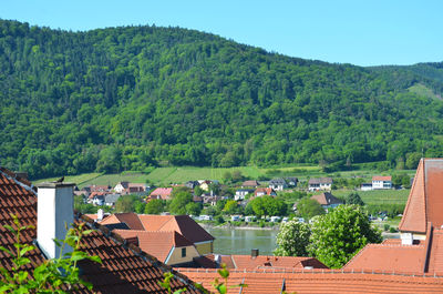 High angle view of townscape against mountains