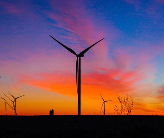 LOW ANGLE VIEW OF SILHOUETTE WINDMILL AGAINST ORANGE SKY