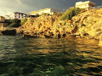 River in city against sky