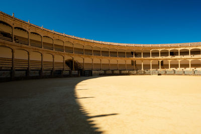 View of historical building against clear blue sky