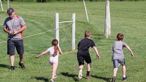 Full length of children playing on grassland