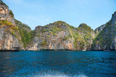 Scenic view of sea and rocks against sky